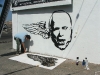 eric sanchez and  matt reynoso installing mural
