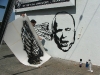 eric sanchez and  matt reynoso installing mural